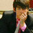 Pixelated image of a person in dark clothing with a pink tie, next to blue background with light blue text reading "Joseph Adam Jonas".