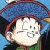 Pixelated image of a character with closed eyes, wearing a blue hat and green clothing against a multicolored background.