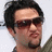 A person with dark hair and sunglasses appears in four -aligned , each showing a slightly different facial expression and head position against a light background