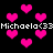 Black background with scattered pink pixelated hearts and repeated white text reading "Michaela<33Michaela<33".