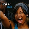 A static image shows a person with a headband and blue top, mouth open in a shout, with pixelated text reading "HEAR HE" and "ROAR" above.