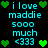 Pixelated cyan text and green heart icons on black background, repeating 'i love maddie sooo much <333' with animated heart positions.
