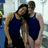 Two people in blue swimsuits stand close together, one with an arm around the other's shoulder; red text appears at bottom right.