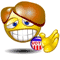 Yellow cartoon face with brown hair, blue eyes, and a wide grin holding a small American flag while waving in