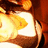 A pixelated animated icon shows a character with light brown hair and white clothing against warm orange-brown background, displaying subtle motion in the upper portion.