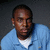 A person in a light blue shirt with a white undershirt appears in four , with text overlays changing in two