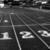 Black-and-white parking lot background with numbered spaces and pink text overlay reading "Track's My Love!" in pixelated font.