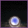 A circular icon with a blue center and brown ring floats against black background, moving across from left to right while emitting light trails