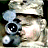 A pixelated contact sheet showing two frames of an animated icon featuring a stone statue head with a camera and green text reading "Original Icons .com" on the right side.