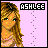 Pixelated image of a person with long brown hair and green eyes, wearing pink clothing against a light purple background with the name 'ASHLEE' in block letters.