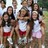 Pixelated static image of multiple figures in motion with visible red and white clothing elements against a blurred background.