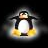 Pixelated penguin with black wings, white belly, and brown beak stands against dark background with glowing yellow feet and light halo effect.