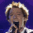 A 48x48 pixel animated contact sheet showing two frames of a Clay Aiken-themed buddy icon with a green text logo on the right side.