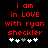 Red pixelated text on black background reads 'i am in LOVE with ryan sheckler' above five heart symbols, two of which are white and three gray.