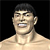 Pixelated close-up of a shirtless person with short dark hair against a black background, mouth open showing teeth and tongue.