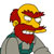 Pixelated character with yellow skin, red hair, and a red bandana wears a gray shirt over green sleeves.