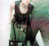 A young person with black hair and red eye makeup appears in multiple poses across a of six , wearing dark sleeveless tops against light backgrounds