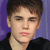 A person with short brown hair and a black shirt appears in three views against a purple background, with the rightmost view showing a gray background.