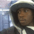 A person wearing a dark hooded jacket with white trim appears in three , with the bottom-left showing a different head angle and the bottom-right blank