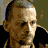 A 4x3 contact sheet of a pixelated animated icon featuring large white text on black background with a partial human face in the top-left corner.