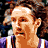 Pixelated image of a person with curly hair wearing purple and white clothing, next to fragmented text on black background.