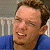 A static image shows a person in blue clothing against a light background with green text reading 'Original Icons .com' on the right.