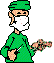 Pixelated character in green surgical attire with mask and turban-like head covering, holding a tool in one hand and a small object in the other, with visible pixelation and color bleeding.