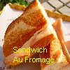 A toasted sandwich cut into two triangular halves on a white plate with a fork, overlaid with yellow text reading "Sandwich Au Fromage".
