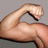 Static pixelated image of a muscular arm flexing against a gray background, rendered in low-resolution with visible dithering and anti-aliasing artifacts.