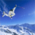 Pixelated static icon of a skier in mid-air against blue sky and snowy terrain with visible dithering and anti-aliasing on edges.