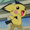 Pixelated yellow cartoon character with black-tipped ears, pink cheeks, and a red mouth opening in three showing head movement from left to right
