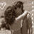 A sepia-toned image of two people embracing, with red text reading "Zac & Vanessa" and "True Love" on a black background.