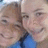 Two pixelated faces in close proximity, one with light brown hair and the other with dark hair, both wearing blue clothing against a blurred background.