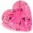 A pixelated pink heart icon with a textured surface appears on the left side of a bright magenta background, accompanied by white text reading "The Heart Is Just A Prize. Something To be Won.".
