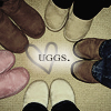 Circular arrangement of multiple pairs of slip-on shoes surrounding a central heart symbol with text.