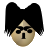 Pixelated face with black hair styled in large upward curves, dark rectangular eyes, and a vertical black mouth on a light beige face against gray background.