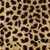 A static pixelated pattern of irregular dark brown and black shapes on a light tan background, resembling a leopard print texture.