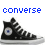 Two pixelated Converse sneakers side-by-side with blue and pink text above them, each showing a black shoe with white laces and a circular eye-like detail on the side.