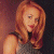 A pixelated image of a woman with long red hair wearing a sleeveless top, positioned next to green text reading 'Original Icons .com' on a dark background.
