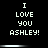 Black background with white pixelated text reading "I LOVE YOU ASHLEY!" in three , each containing the same phrase