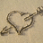 Two show a heart-shaped sand drawing with an arrow, paired with text overlays on a sandy background