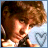 Pixelated static image of a person with voluminous brown hair and light skin tones, partially cropped on the right side against a gradient background transitioning from dark to light blue.