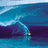 Pixelated image of a surfer riding a wave with blue text on a bright cyan background.