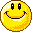 Yellow circular pixelated smiley faces with black eyes and mouths, some showing blue-and-white checkered teeth against a gray background.