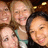 Five pixelated faces in close proximity, some with visible hair and clothing details against a dark background.