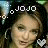 A 48x48 pixel animated contact sheet showing two side-by-side frames of a cartoon-style female character with brown hair, wearing hoop earrings and a white heart-shaped accessory, with "JOJO" text above her head in different colors across the frames.