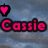 Pixelated pink text 'Cassie' with black outline on blue cloudy background, surrounded by pink heart icons in different positions.