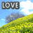 A pixelated landscape with a yellow field, blue sky, and gray tree, featuring the word LOVE in white text on a dark background in the top-left corner.
