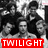 Black-and-white group photograph of multiple people with red text overlays reading TWILIGHT, BOYS, and R-SEXY!! in pixelated font.