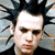 A 2x2 contact sheet of four animated frames showing a person with spiky black hair and dark clothing in various poses against a gray background.
